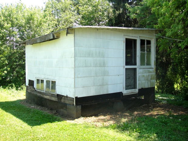 Side of chicken coop with door